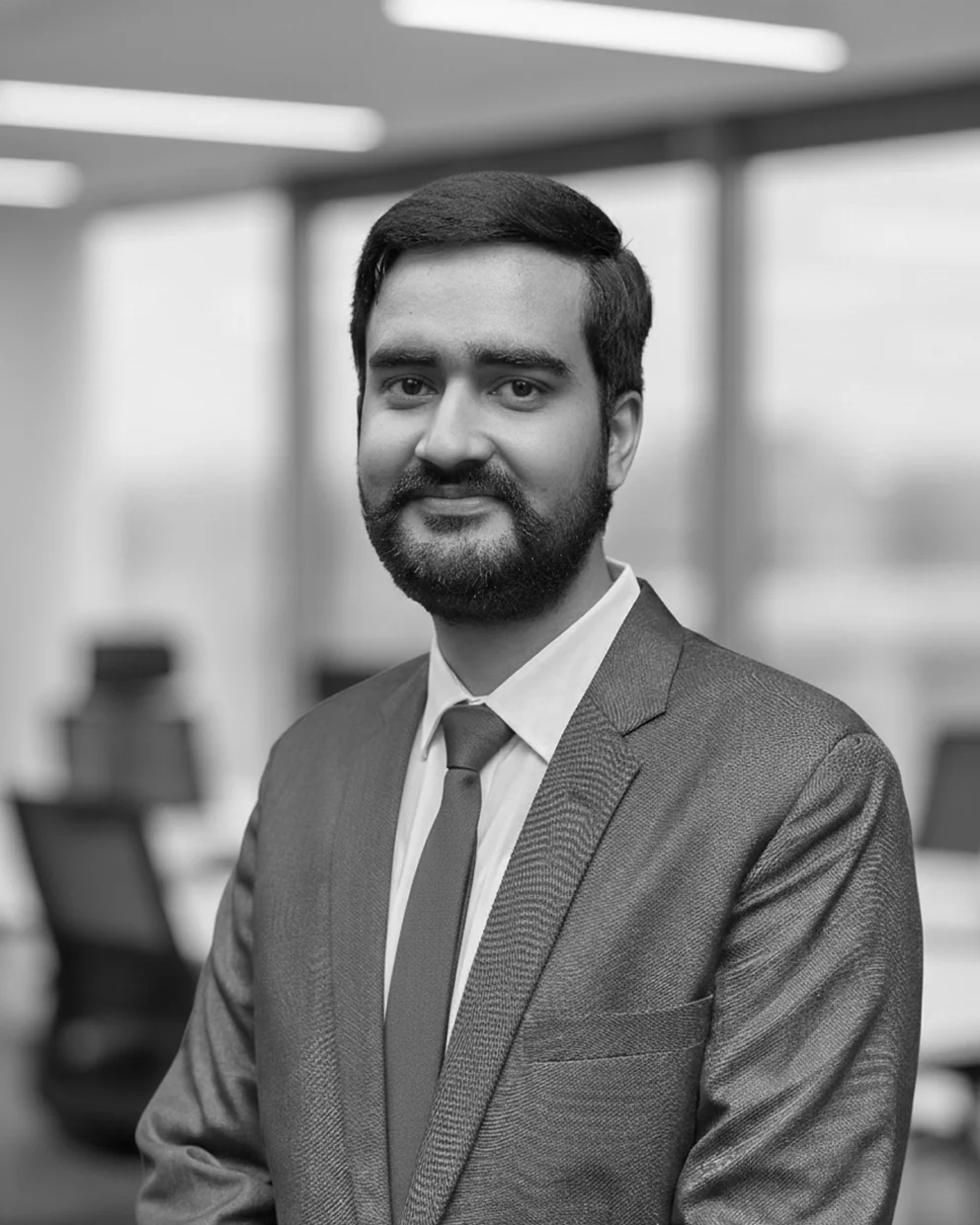 Ahsan Rasheed, the Co-founder, wearing a suit.