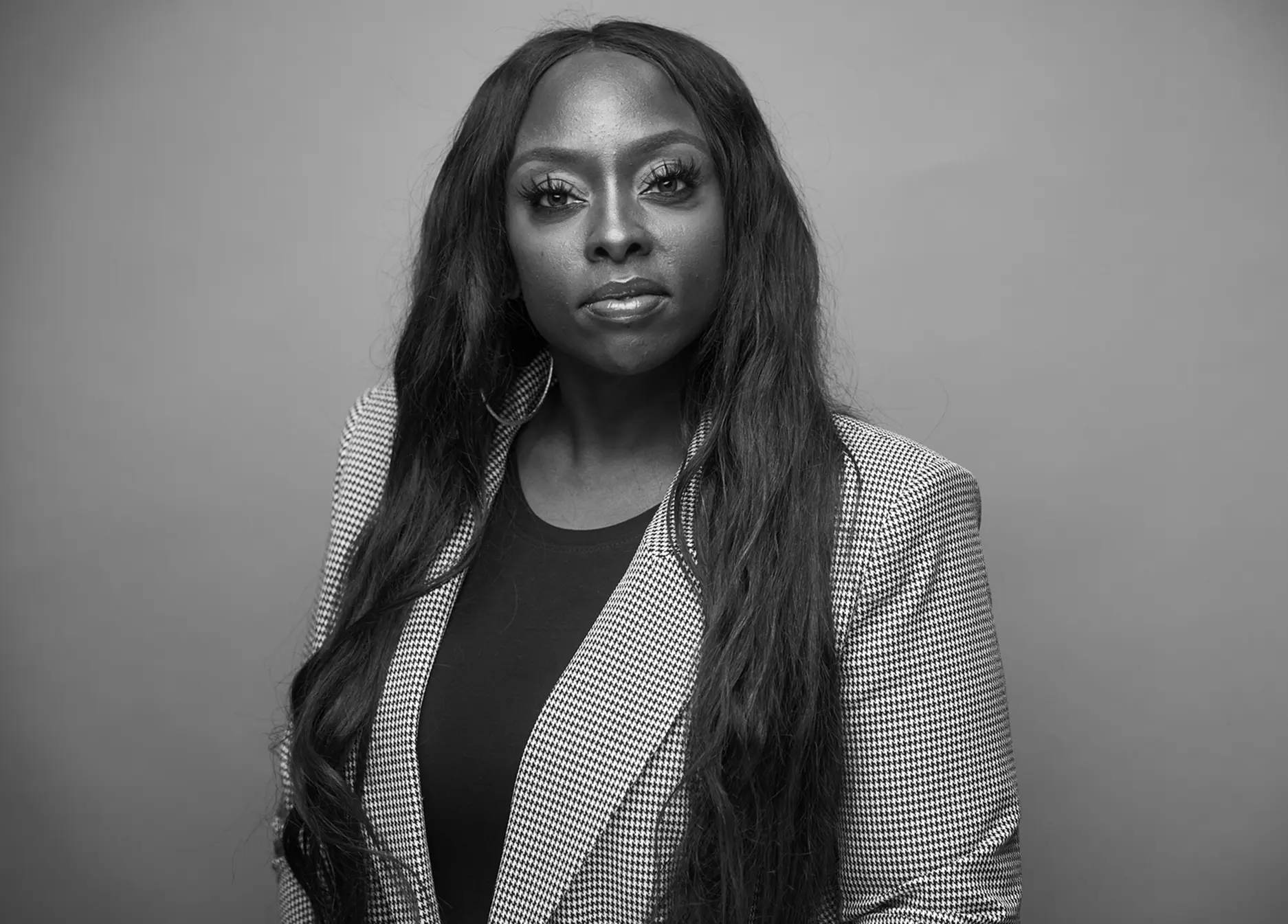 Dr Nneka Bell, the Co-founder, wearing a suit.