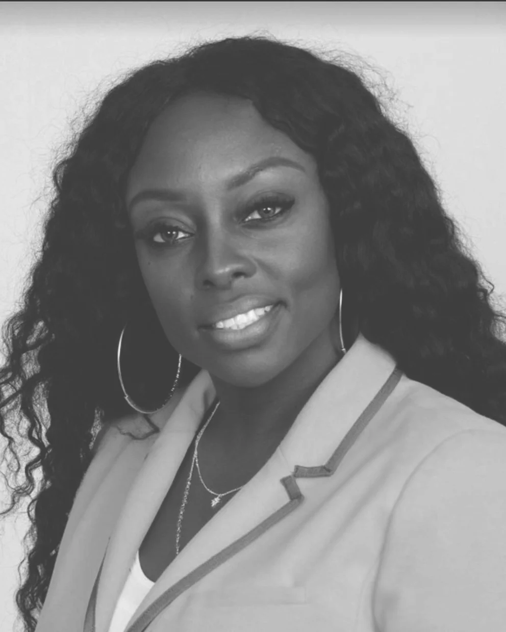 Dr Nneka Bell, the Co-founder, wearing a suit.